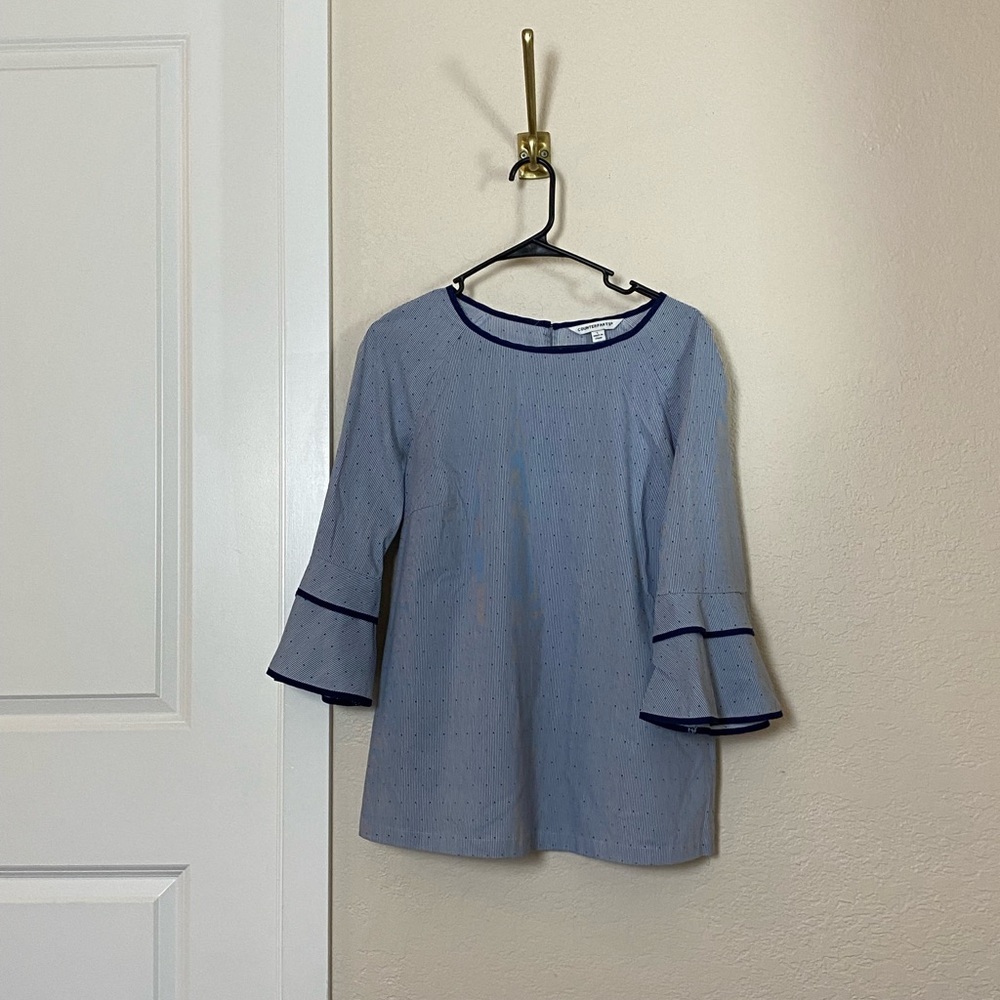 Navy blue top with flare sleeve detail. Good condition.